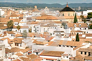 Bright morning over historical cityscape of Cordoba with white houses and roofs, Spain