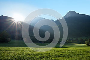 Bright morning sun over the mountain crest in the allgau alps