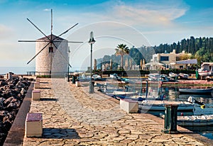 Bright morning view of old windmill Anemomilos. Sunny spring cityscape of Kerkira tovn, capital of Corfu island, Greece, Europe