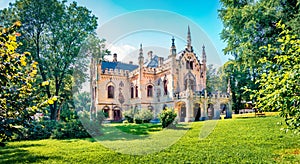 Bright morning view of Sturdza castle. Picturesque summer scene of the green park in Miclauseni monastery. Colorful landscape of R