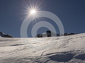 Bright mountain midday sun and hard firn on Dachstein glacier, Austria, Alps