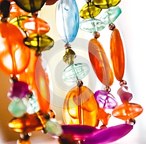 Bright multi-colored glass beads closeup. Blur and abstraction