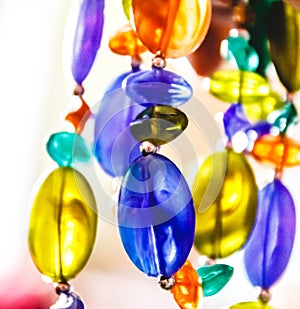 Bright multi-colored glass beads closeup. Blur and abstraction