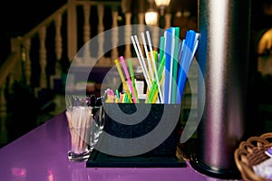 Bright multi colored straws on the bar