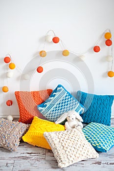 Bright multicolored knitted cushions