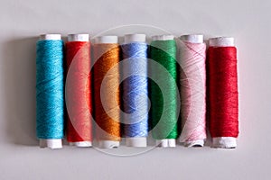 Bright Multicolored Sewing Thread Spools Row