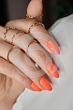 Bright neon manicure on female hands with accessories. Nail design.