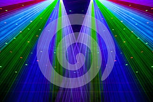 Bright nightclub red, green, purple, white, pink, blue laser lights cutting through smoke machine smoke making light patterns