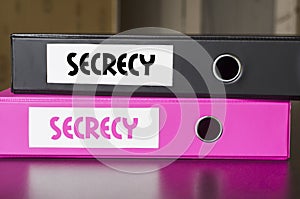 Bright office folders and secrecy text concept