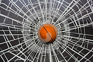 Bright orange basketball ball in broken glass