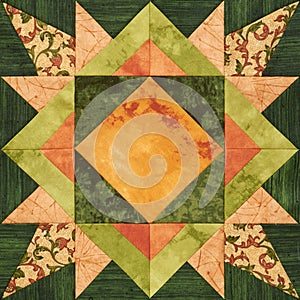 Bright orange-green geometric patchwork block from pieces of fabrics