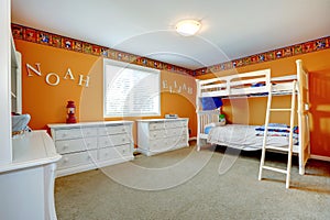 Bright orange kids room with bulk bed