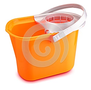 Bright orange mop bucket. Isolated on white background