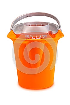 Bright orange mop bucket. Isolated on white background