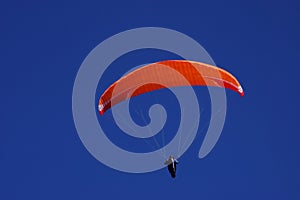 Bright orange parachute on a beautiful sunny day