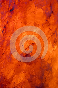 Bright orange salt lamp rock background texture