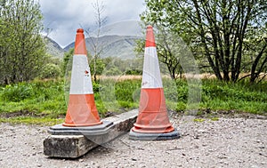 Bright orange traffic cones in the scottish highlands