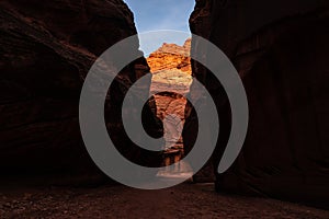 Bright Orange Wall Peeks Through Dark Canyon