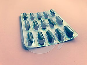 Bright oval oblong useful tablets in an unused blister. medicines to fight various diseases. medicines on a bright popular