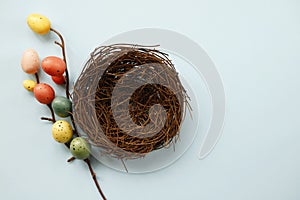 Bright painted eggs on blue background, top view with copy space for text. Happy Easter concept