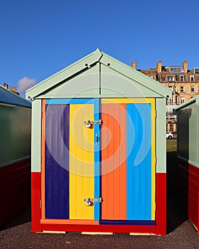 A bright painted holiday beach hut.