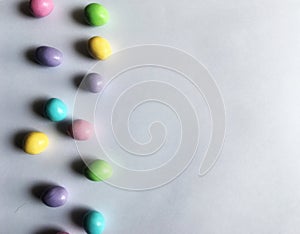 Bright pastel Easter candy on white background