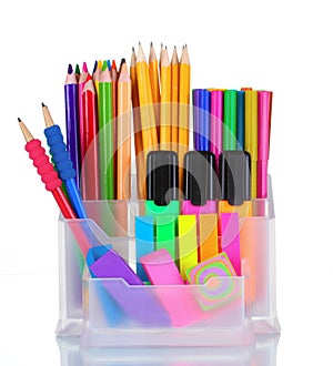 Bright pens, pencils and markers in holder