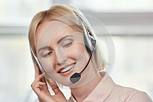 Bright picture of friendly female helpline operator.