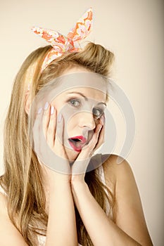 Bright picture of surprised woman face over gray