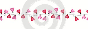 Colorful Valentine`s Day Holiday Intertwined Heart Shape String Lights on White Background Vector Seamless Border photo