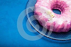 Bright pink cream cake with white chocolate. Blue background. Place for text
