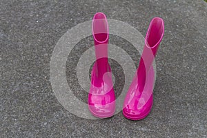 Bright pink rubber boots