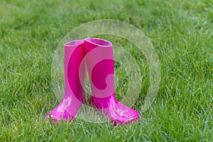 Bright pink rubber boots