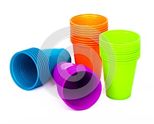 Bright plastic cups isolated on white