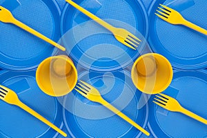 Bright plastic disposable tableware, background