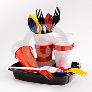 Bright plastic tableware isolated on white background