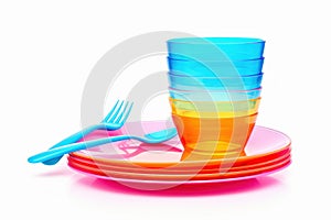 Bright plastic tableware isolated on white table. Generate Ai