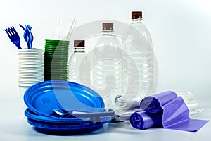 Multicolored plastic tableware isolated on white