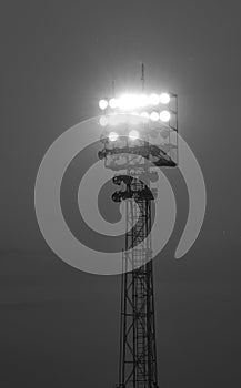 powerful floodlights from the lighting tower turned on during the event at the stadium photo