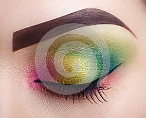 Bright professional makeup female eye. Close-up. Perfect make-up