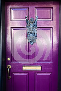 Bright Purple Door with Elaborate Knocker