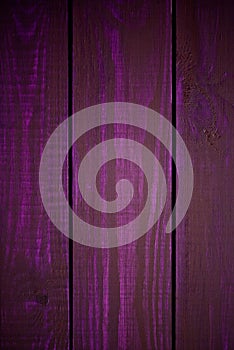 Bright purple wood texture as a background vignette texture