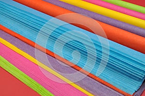 Bright rainbow colored reams (rolls) of tissue wrapping paper for gift wrapping