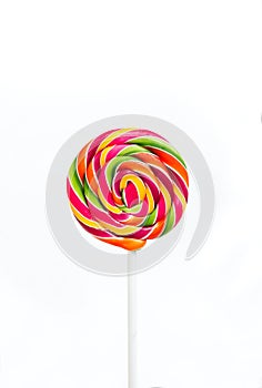 Bright rainbow round lollipop. Isolated on white background