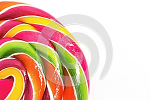 Bright rainbow round lollipop. Isolated on white background.Copy space