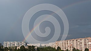 Bright Rainbow in the Sky Over the City