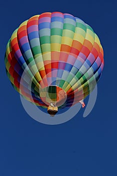 Bright rainbows flying high in the skies at the Albuquerque International Balloon Fiesta special shapes rodeo. photo