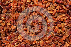 Bright raisins close-up. The concept is raw food, vegetarianism, healthy eating.