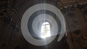 Bright rays of the sun shine in the Christian church. The descent of the Holy Spirit from heaven.
