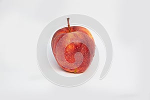 Bright red Apple with water drops